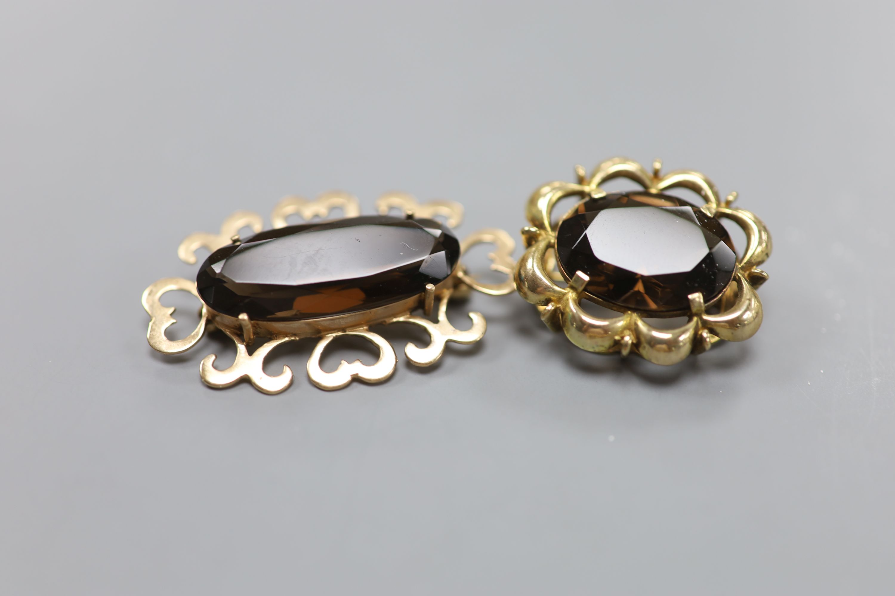 A modern 9ct white metal, sapphire, diamond and cultured pearl set bar brooch, 61mm and four other modern 9ct gold and gem set brooches, including amethyst and smoky quartz